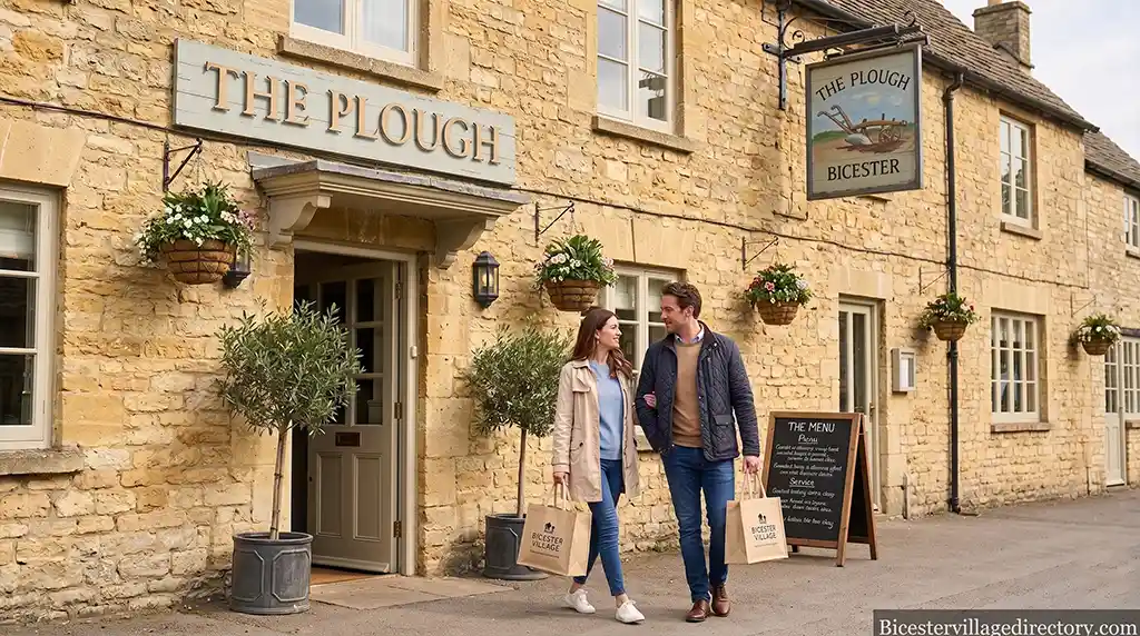 A cozy, traditional English inn exterior and modern hotel accommodation within a short walking distance to Bicester Village.